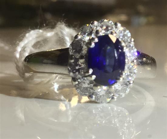 14kt white gold sapphire & diamond ring, sapphire 1.10 carats, 10 diamons 0.85 carats